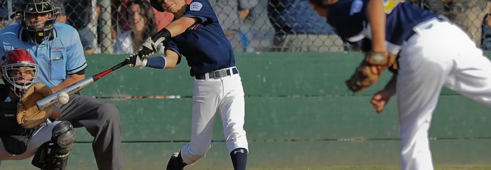 youth-baseball-player-in-batters-box-making-contact-with-ball