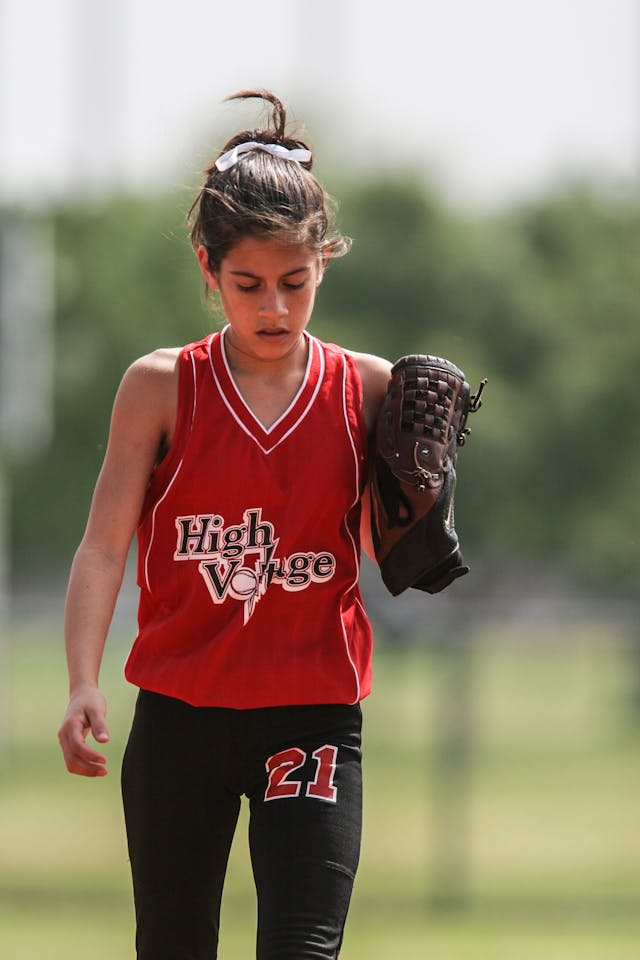 young-female-softball-player-looking-dejected